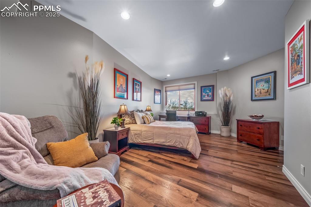 4586 East Best Road Larkspur, CO 80118 - Photo 31 of 50 Bedroom with wood finished floors and recessed lighting