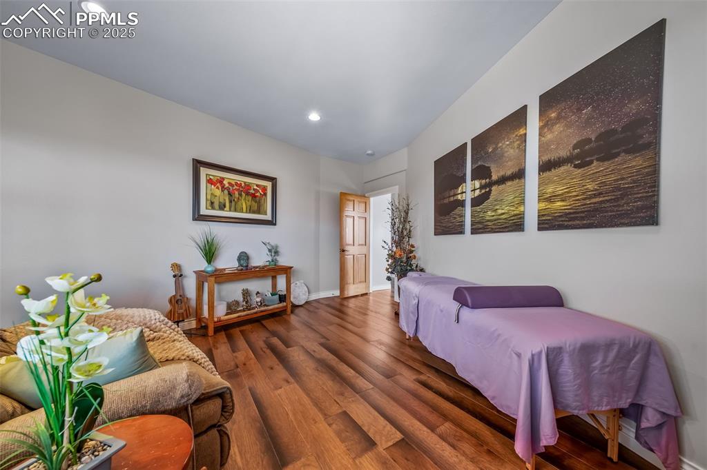 4586 East Best Road Larkspur, CO 80118 - Photo 39 of 50 Living area featuring wood finished floors and recessed lighting