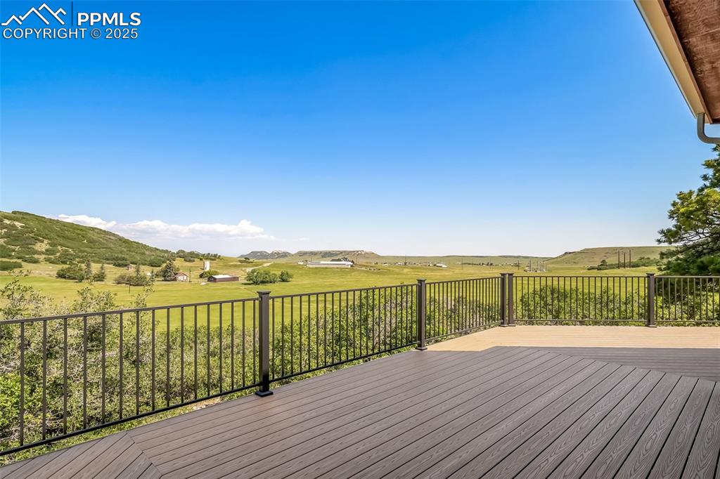 4586 East Best Road Larkspur, CO 80118 - Photo 40 of 50 Deck featuring a view of countryside