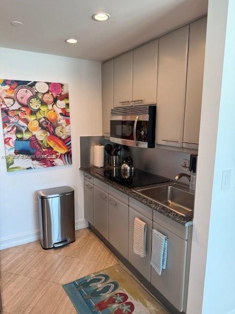 101 Ocean Drive, Unit 906 Miami Beach, FL 33139 - Photo 13 of 35 a kitchen with stainless steel appliances granite countertop a refrigerator and a stove top oven