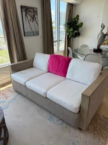 a living room with furniture and a window