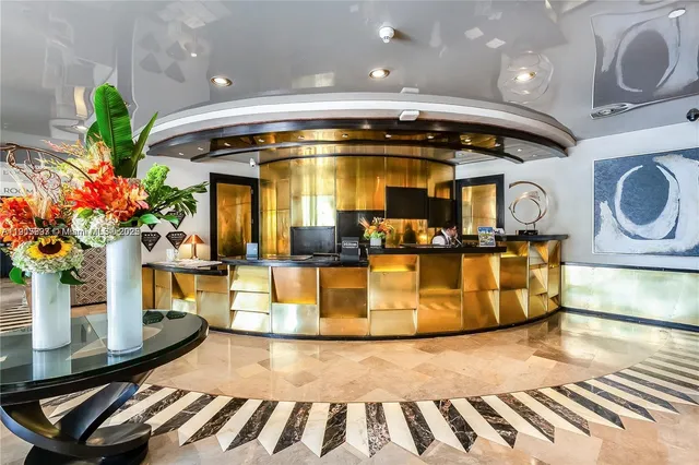 a lobby with chandelier and living room