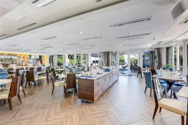 a large room with lots of furniture and lots of tables