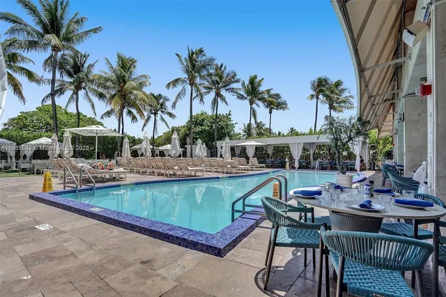 a view of a swimming pool with chairs