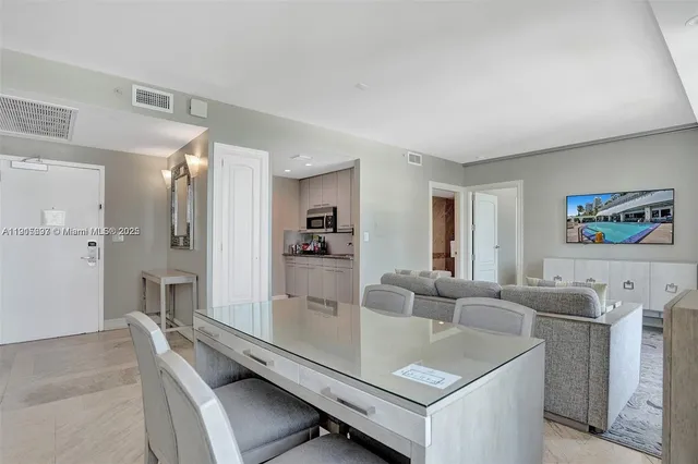 a living room with furniture and a table