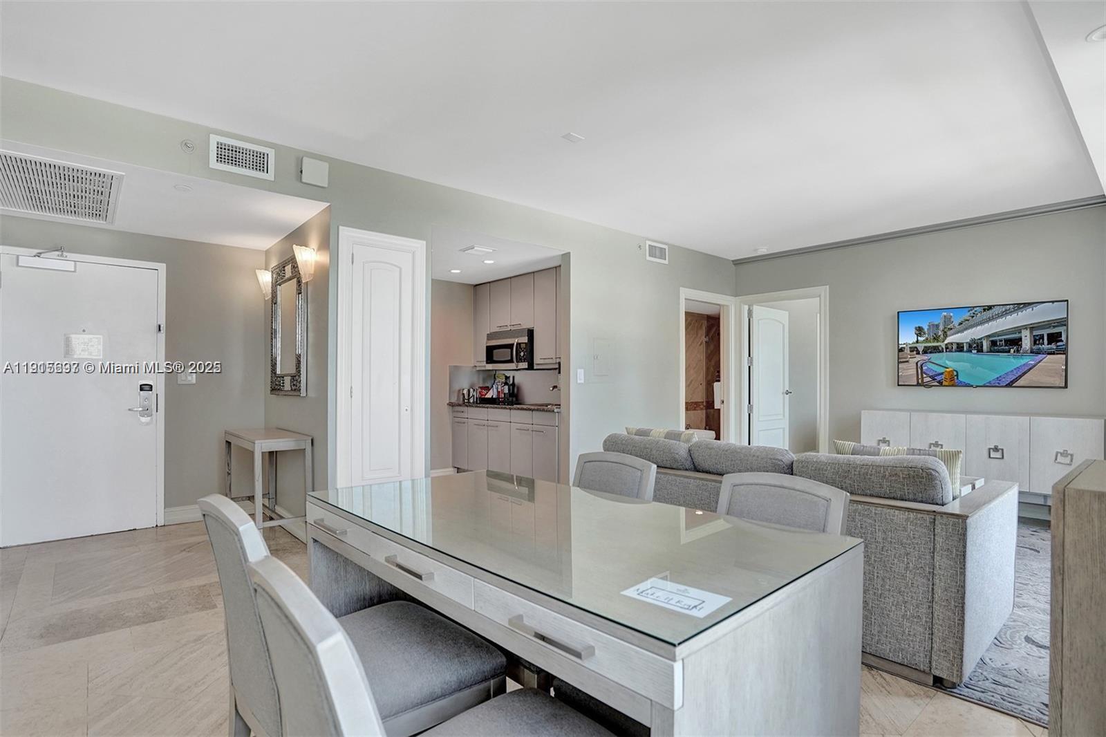 101 Ocean Drive, Unit 906 Miami Beach, FL 33139 - Photo 8 of 35 a living room with furniture and a table