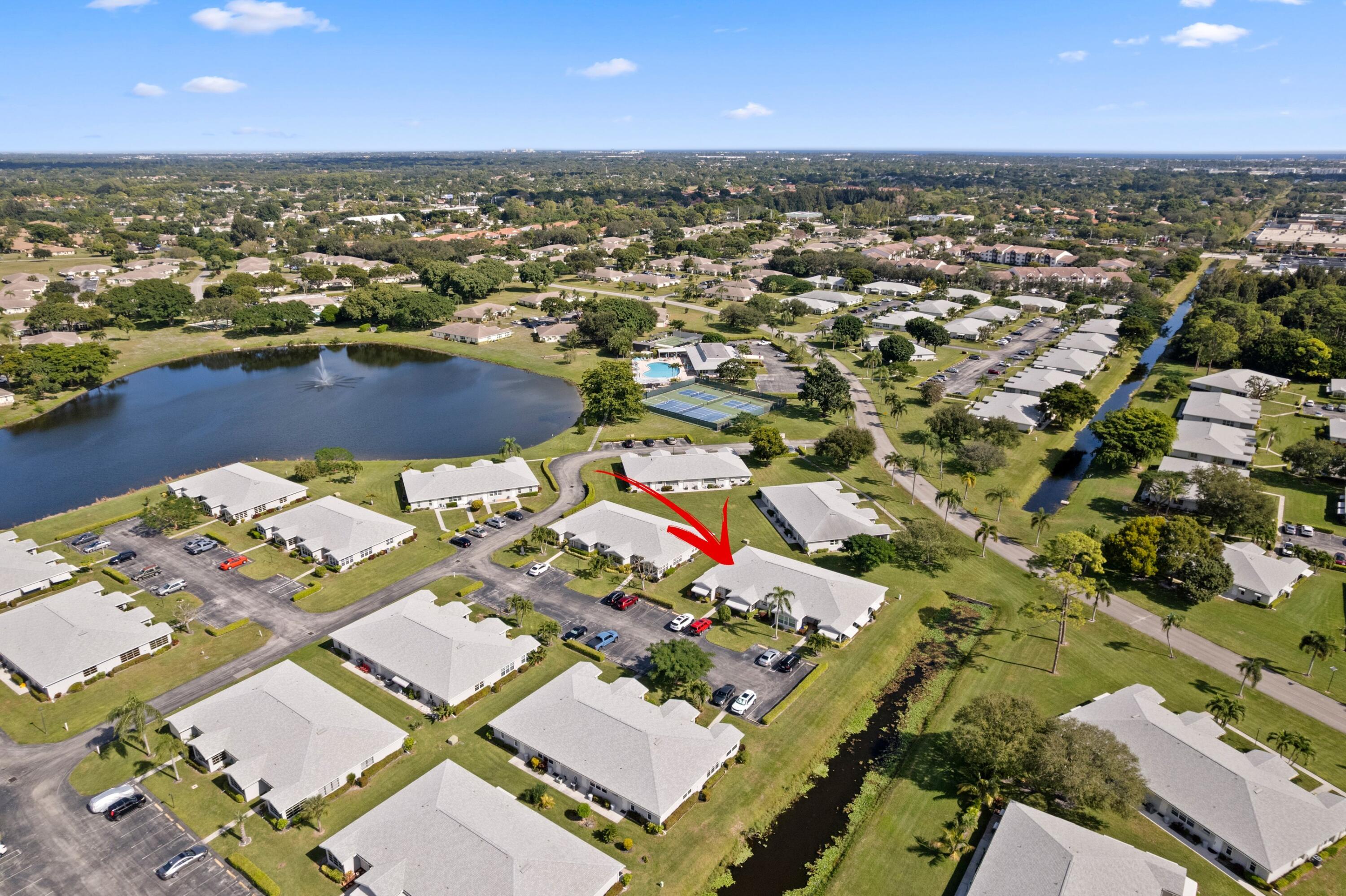 an aerial view of a houses with a lake view