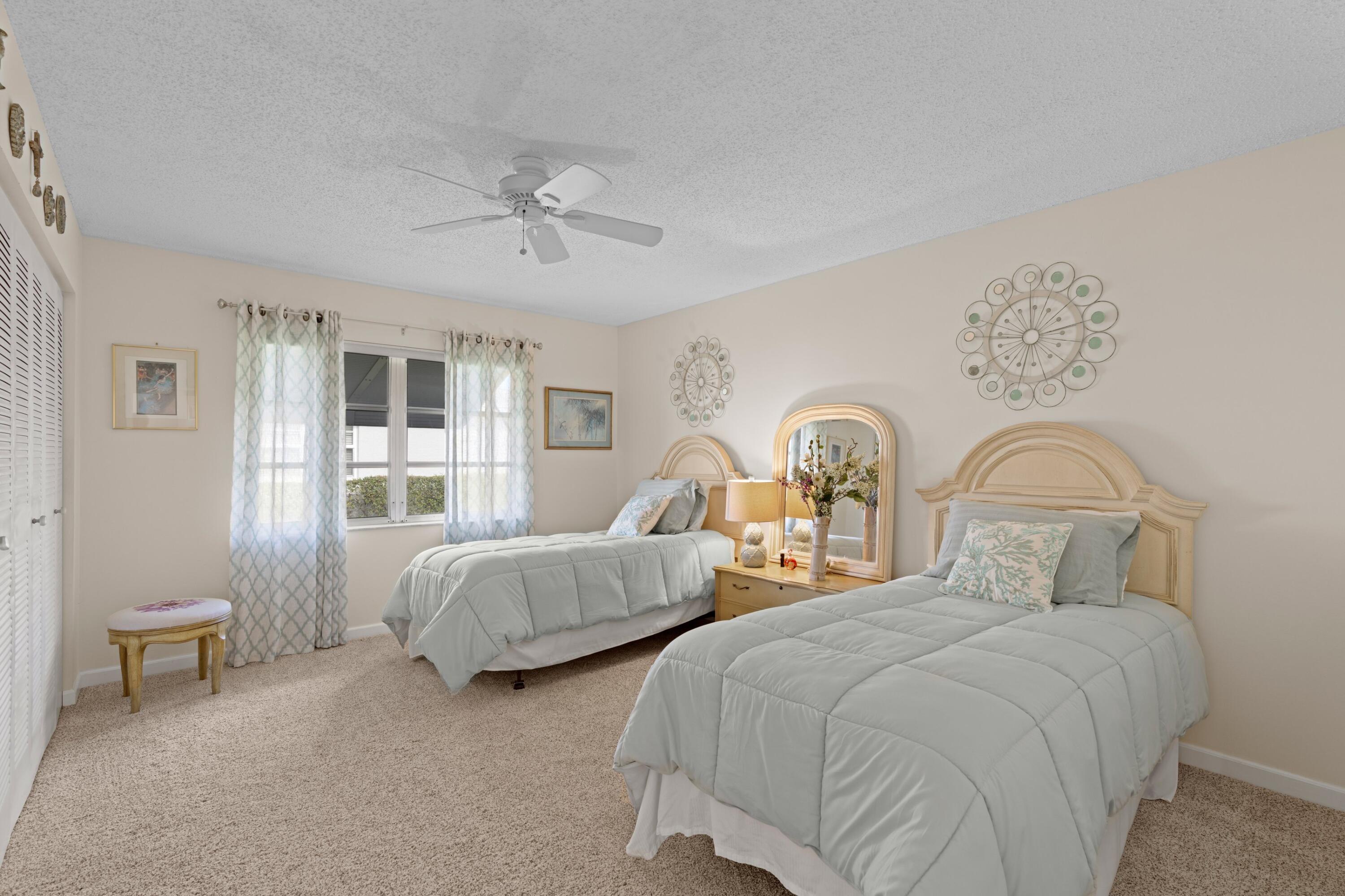 14609 Canalview Drive, Unit 231A Delray Beach, FL 33484 - Photo 12 of 33 a bedroom with two beds and painting on the wall