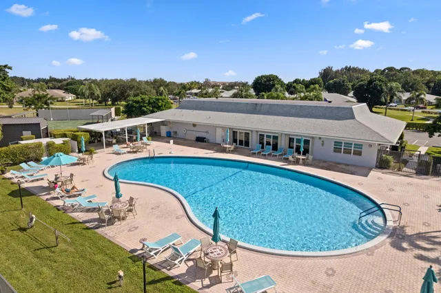 swimming pool view with a lake view