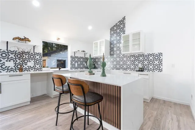 a dining room with furniture and wooden floor