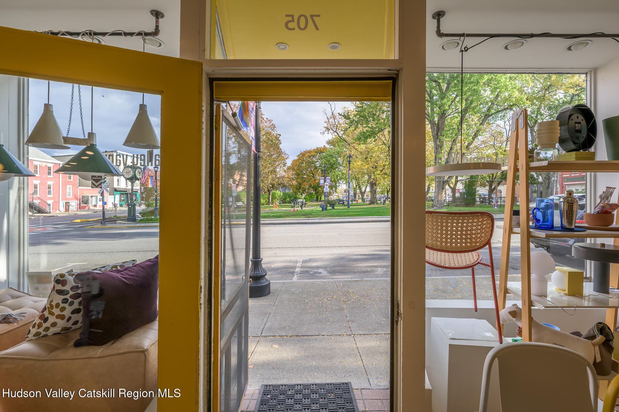 705 Warren Street Hudson, NY 12534 - Photo 2 of 40 a balcony view with a fireplace and a large window