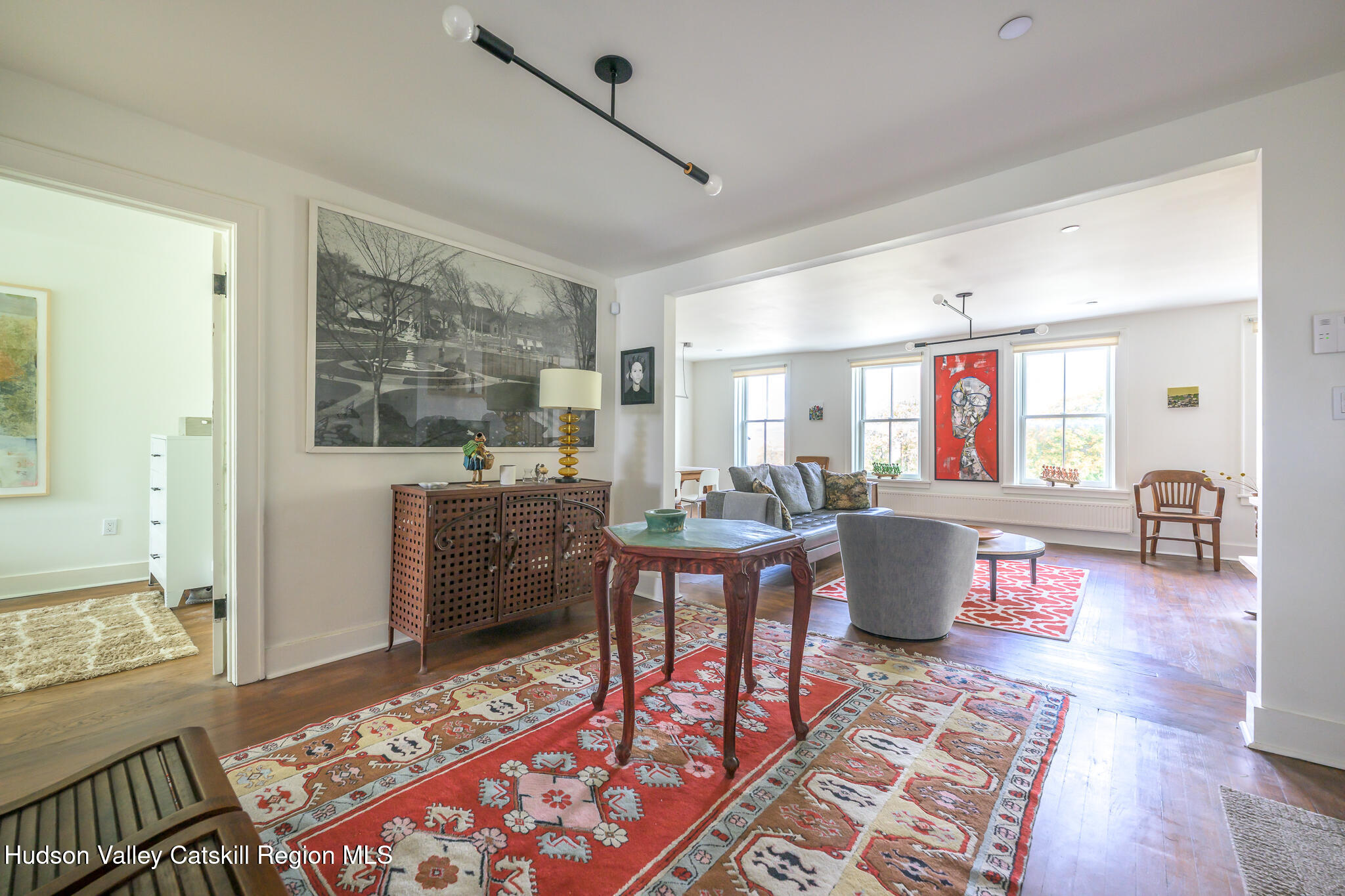705 Warren Street Hudson, NY 12534 - Photo 22 of 40 a living room with furniture and a table