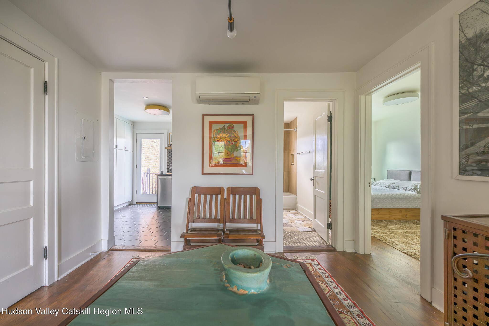 705 Warren Street Hudson, NY 12534 - Photo 25 of 40 a view of a livingroom with wooden floor and a bedroom