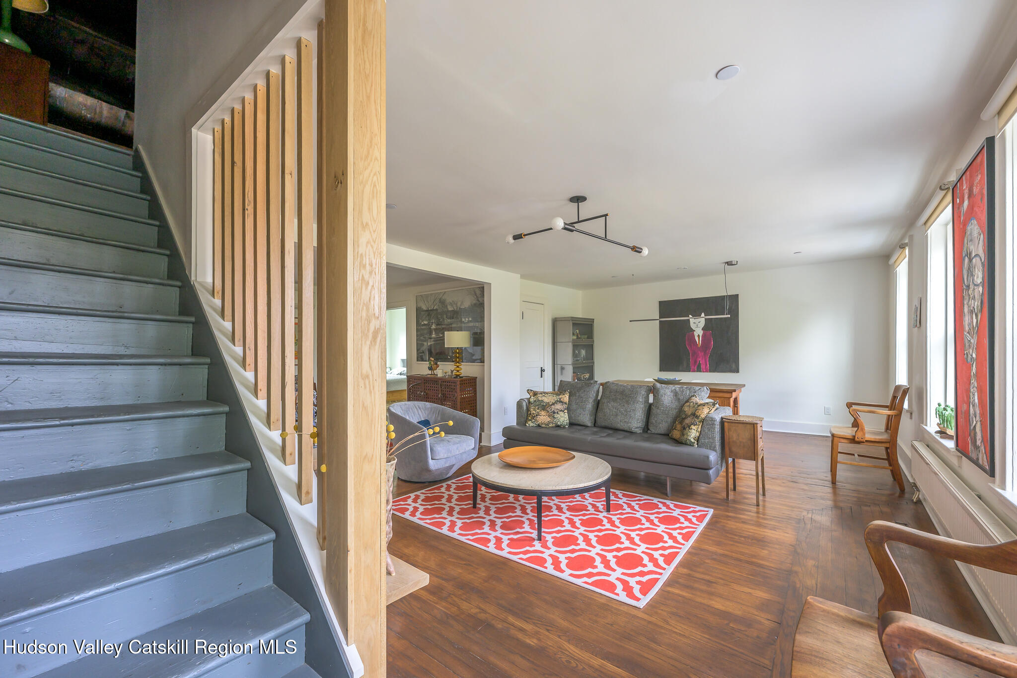705 Warren Street Hudson, NY 12534 - Photo 30 of 40 a living room with furniture and a dining table
