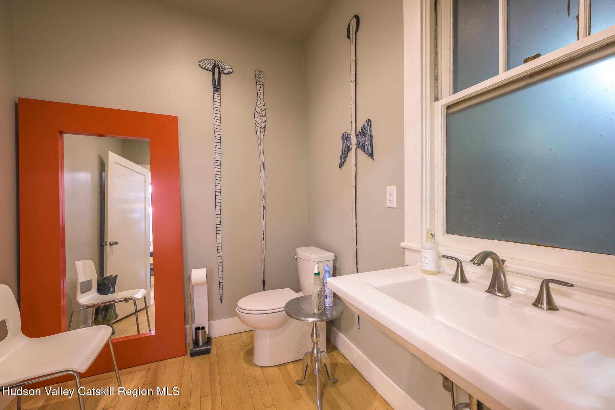 705 Warren Street Hudson, NY 12534 - Photo 9 of 40 a bathroom with a granite countertop sink and a mirror