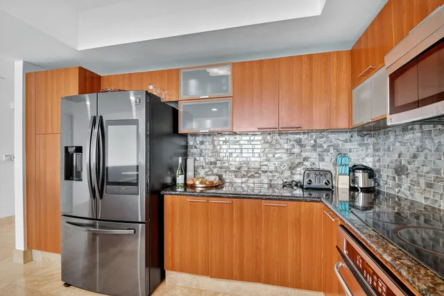 a terrace with outdoor seating and city view