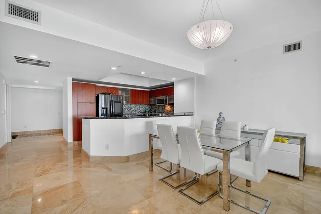 a bedroom with furniture and a large window