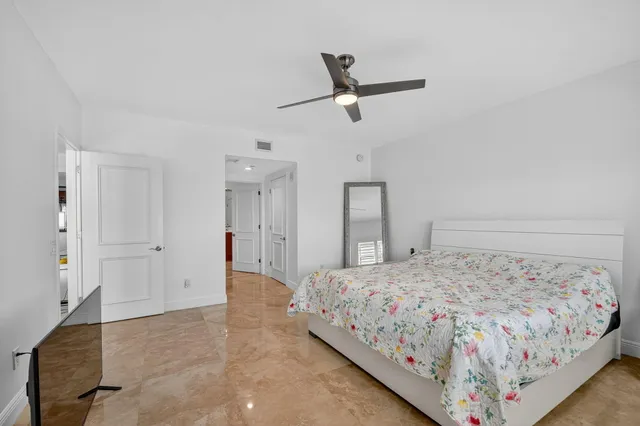a bathroom with a shower sink vanity mirror and toilet