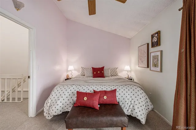 a bedroom with bed and a window