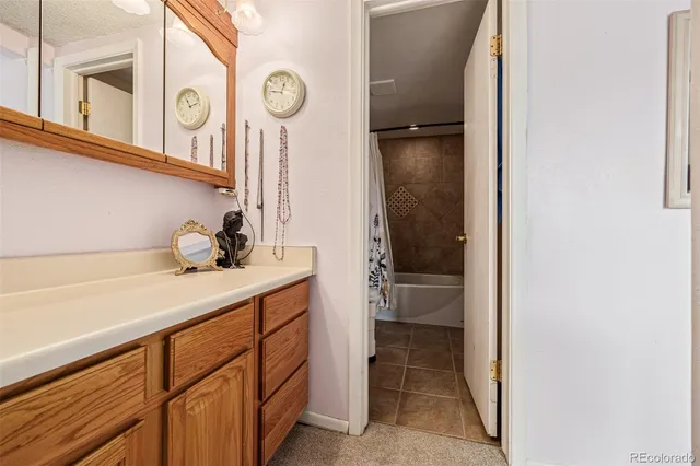 a kitchen with a refrigerator and a sink