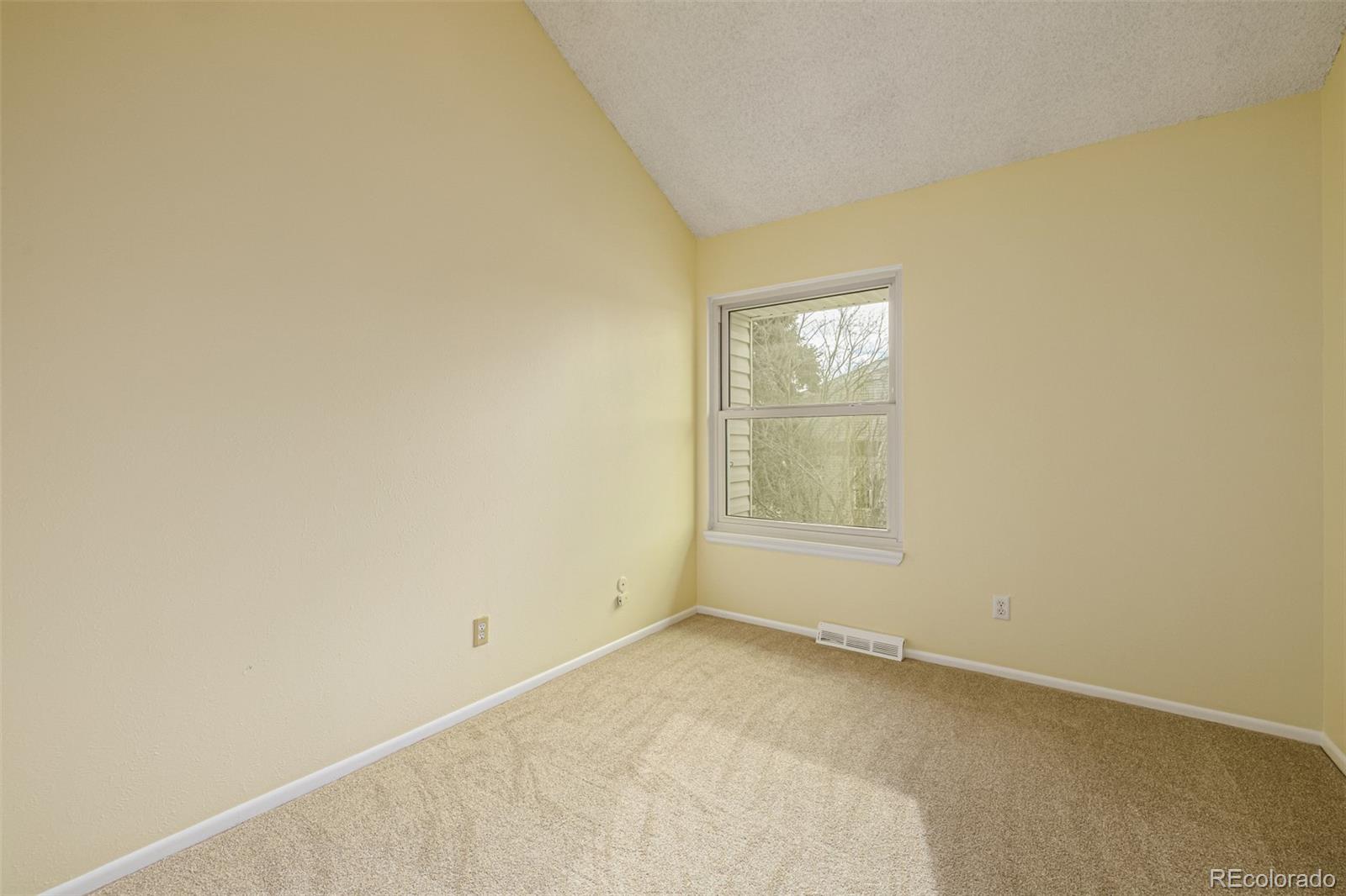 4233 East Maplewood Way Centennial, CO 80121 - Photo 23 of 50 a view of an empty room with a window