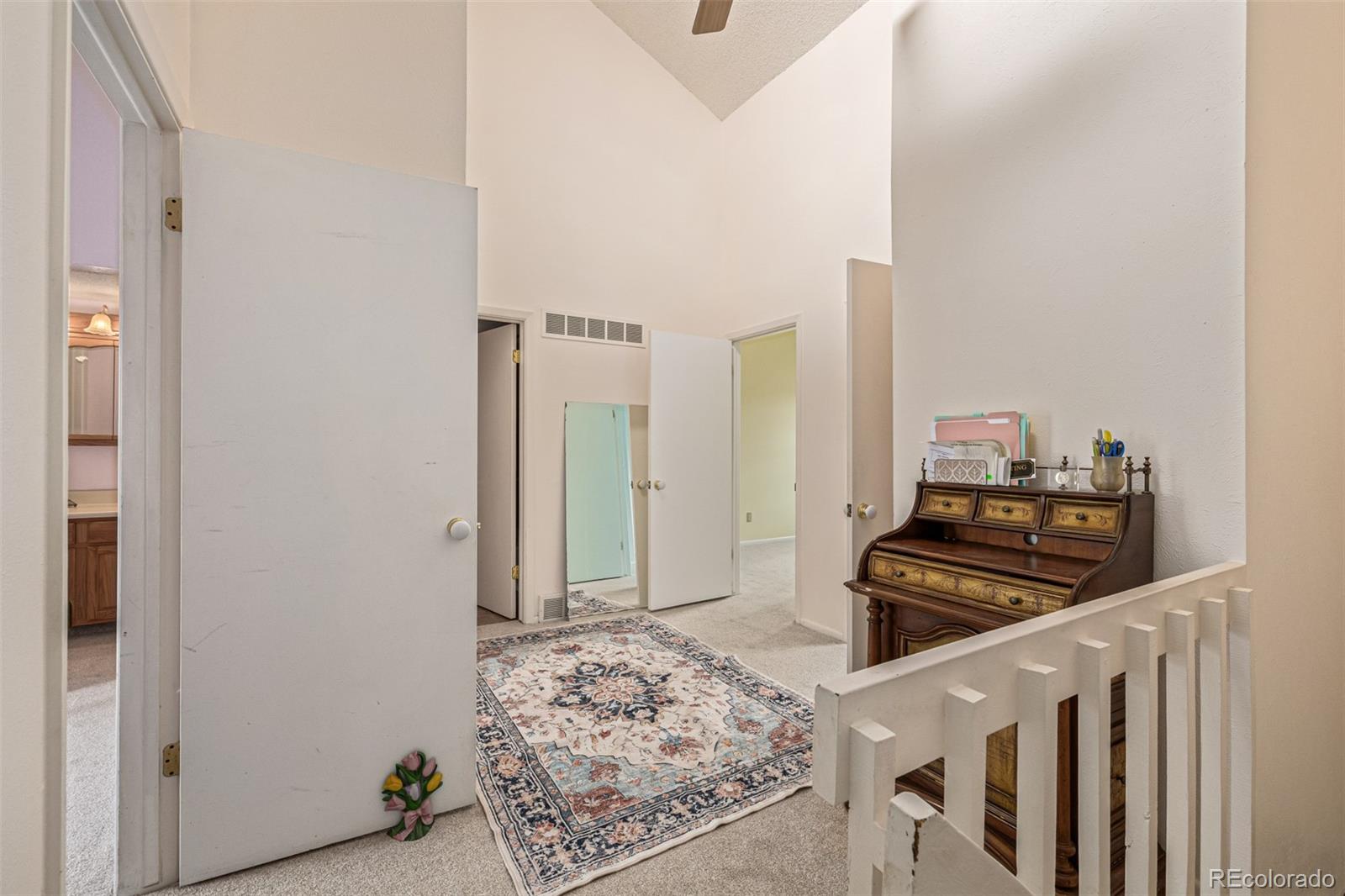 4233 East Maplewood Way Centennial, CO 80121 - Photo 25 of 50 a kitchen with stainless steel appliances granite countertop a stove and a refrigerator
