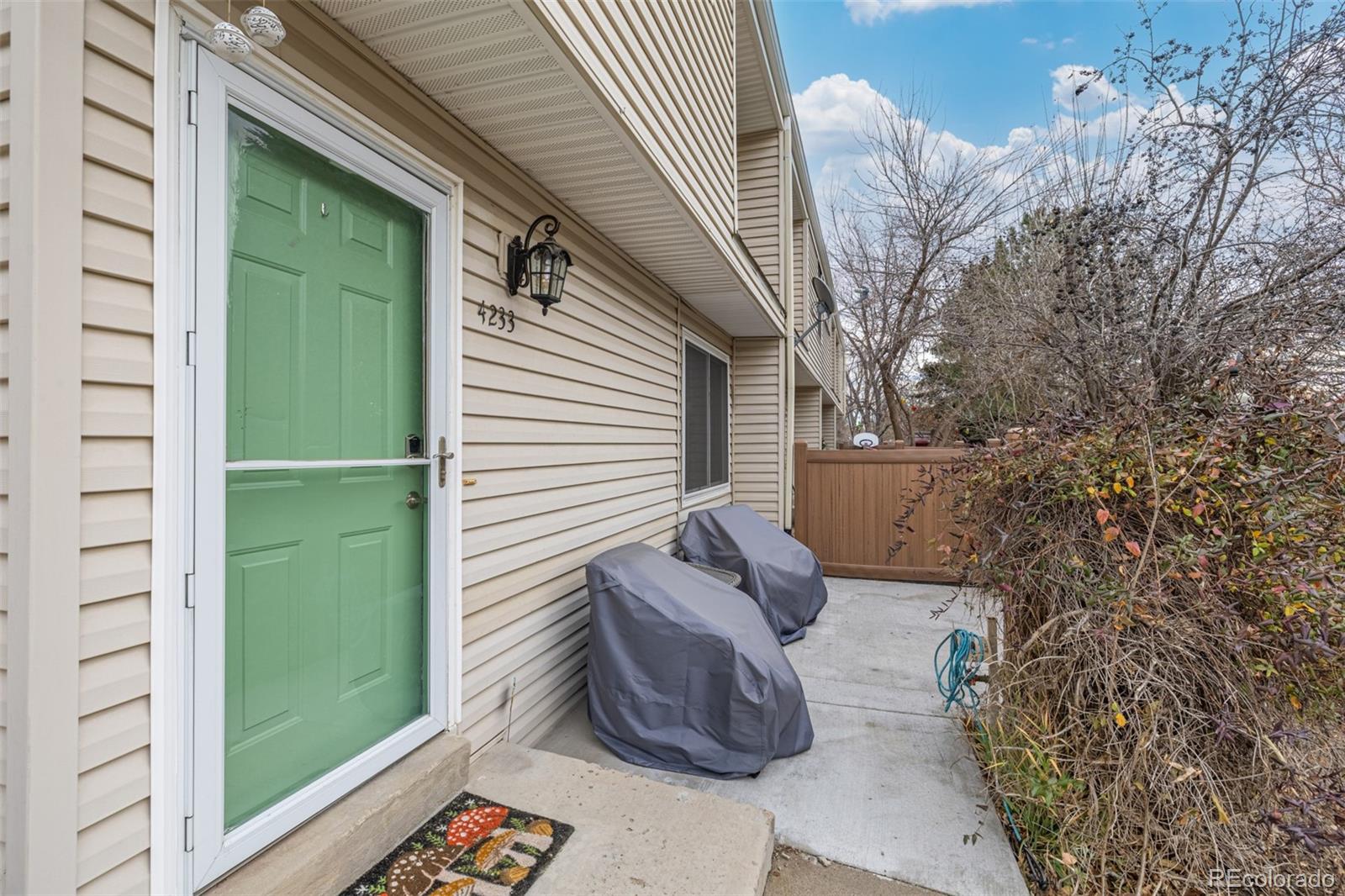 4233 East Maplewood Way Centennial, CO 80121 - Photo 37 of 50 a view of a two chairs in the balcony