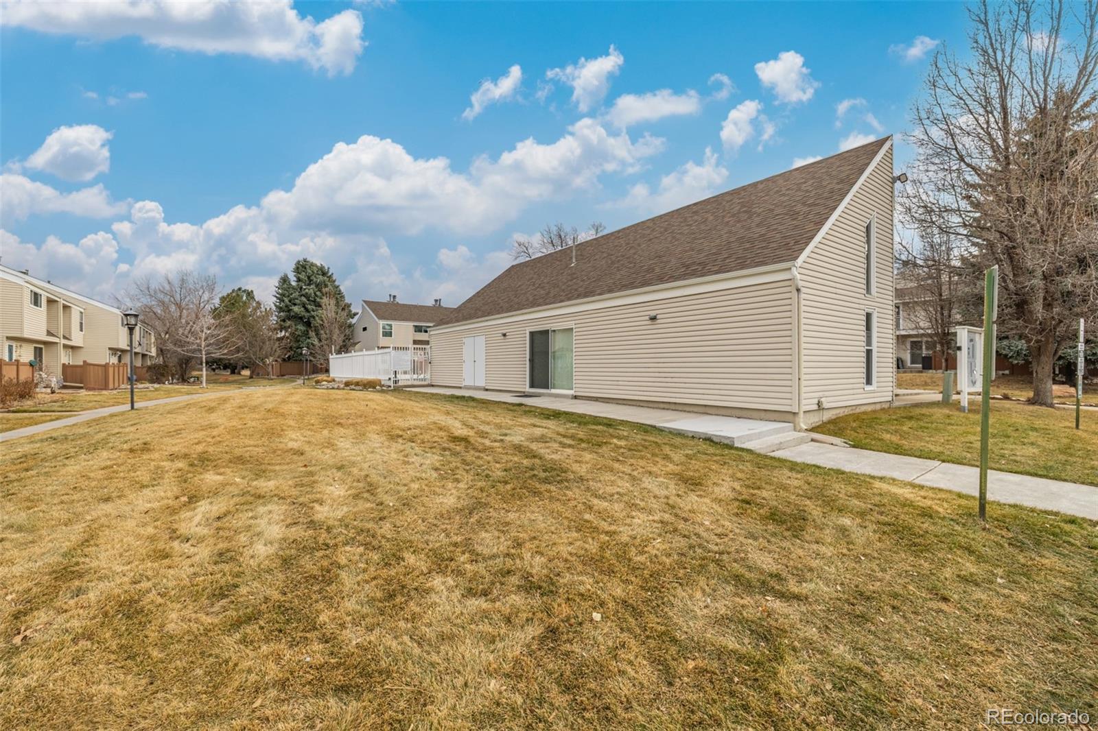 4233 East Maplewood Way Centennial, CO 80121 - Photo 41 of 50 a view of an house with backyard space