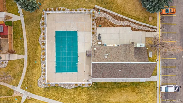 an aerial view of a house with a yard