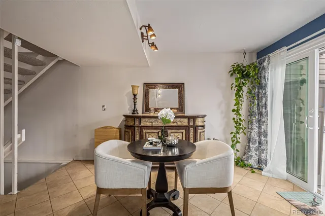 a view of a dining room with furniture and window
