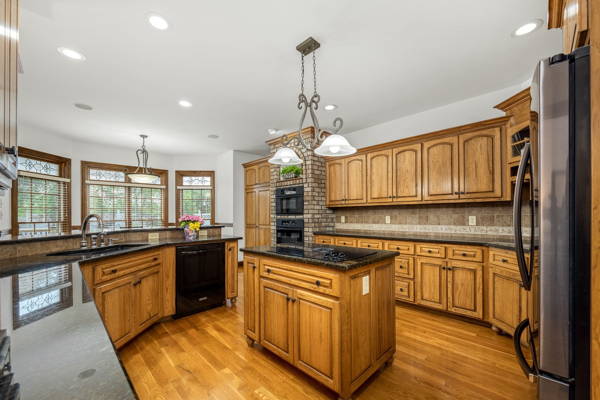3040 Havasu Drive Spring Hill, TN 37174 - Photo 21 of 55 a kitchen with stainless steel appliances granite countertop a stove a sink dishwasher and a refrigerator