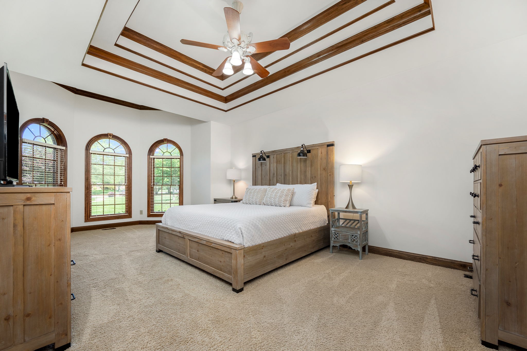 3040 Havasu Drive Spring Hill, TN 37174 - Photo 25 of 55 a spacious bedroom with a bed and a chandelier