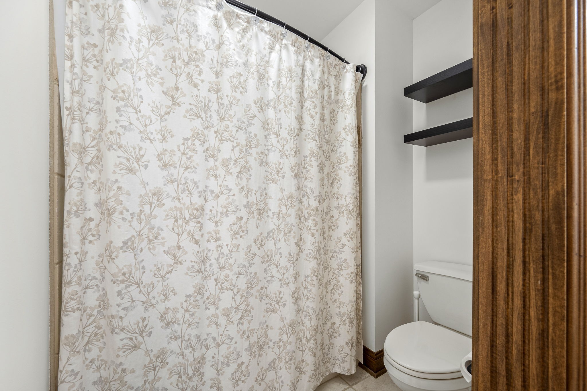 3040 Havasu Drive Spring Hill, TN 37174 - Photo 42 of 55 a white toilet sitting next to a shower curtain