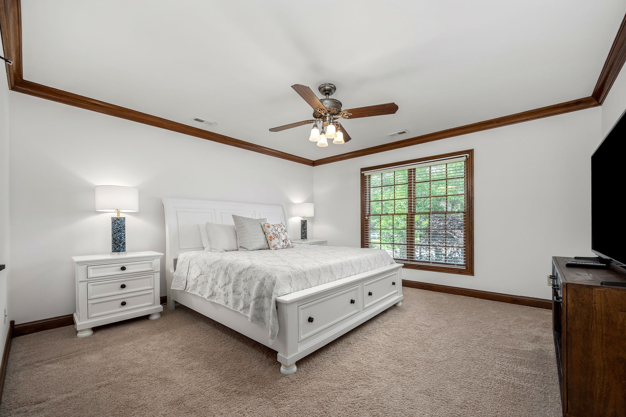 3040 Havasu Drive Spring Hill, TN 37174 - Photo 43 of 55 a spacious bedroom with a bed and a tv on the dresser