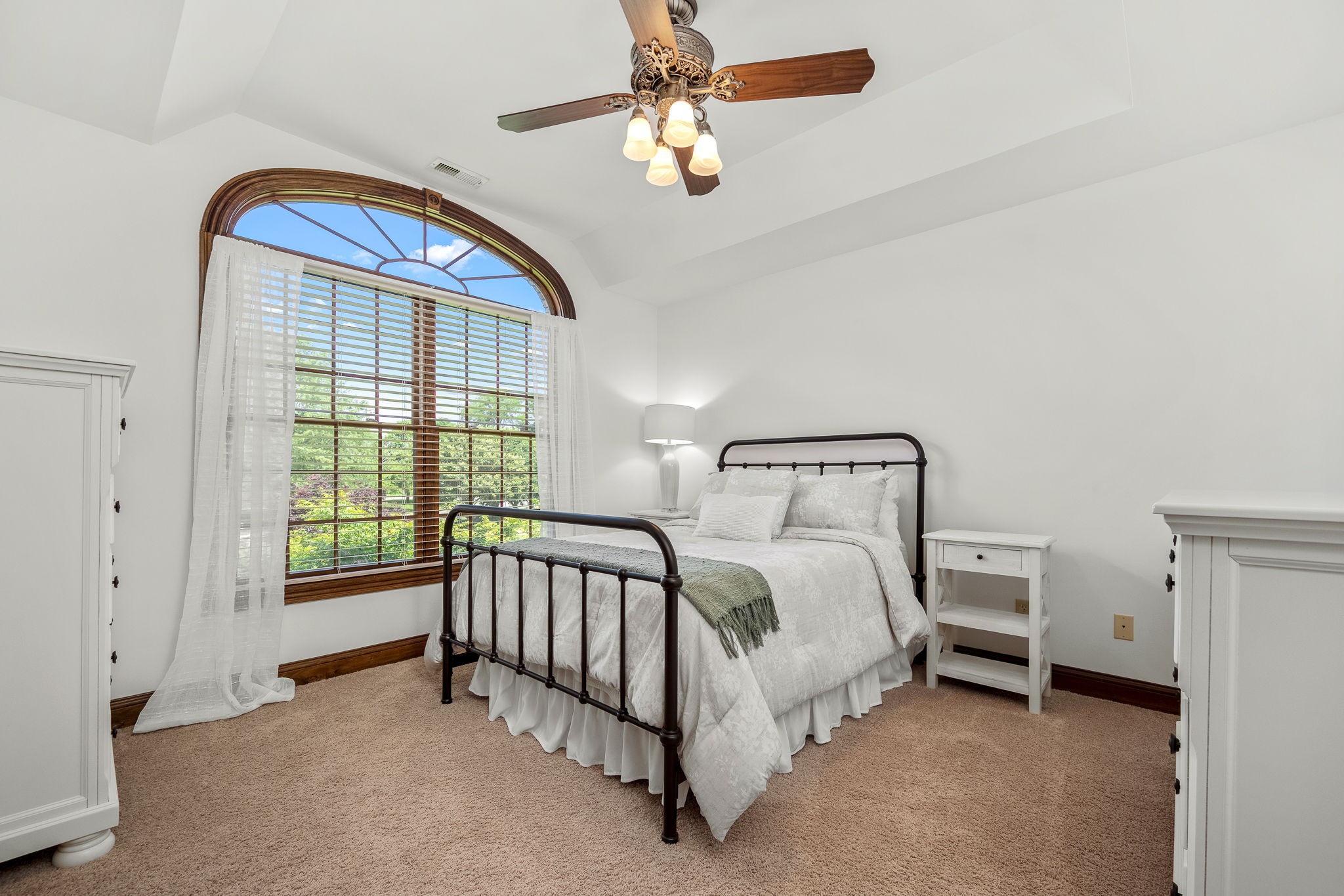 3040 Havasu Drive Spring Hill, TN 37174 - Photo 47 of 55 a spacious bedroom with a bed and a chandelier