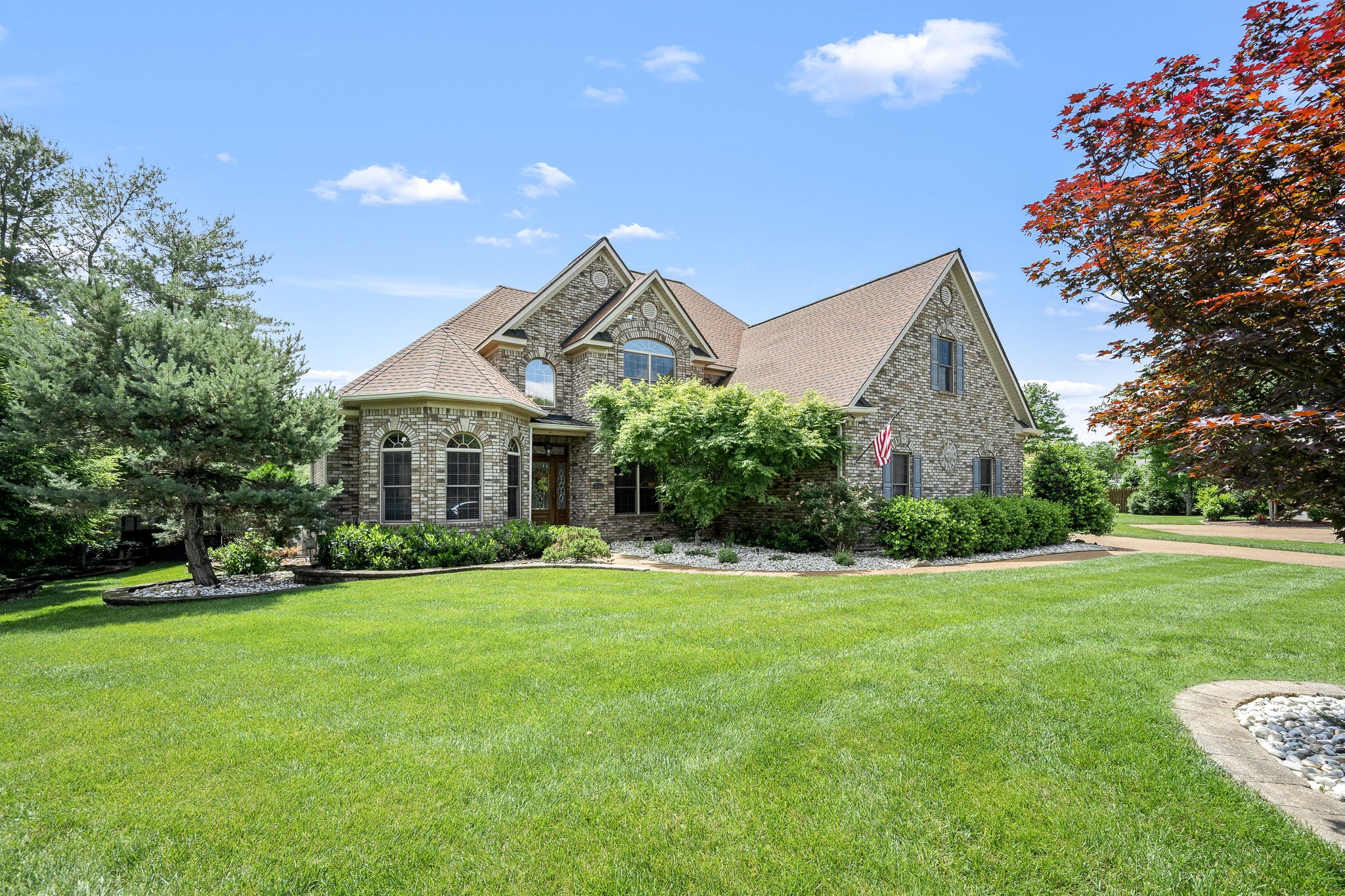 3040 Havasu Drive Spring Hill, TN 37174 - Photo 5 of 55 a front view of a house with a yard and garage