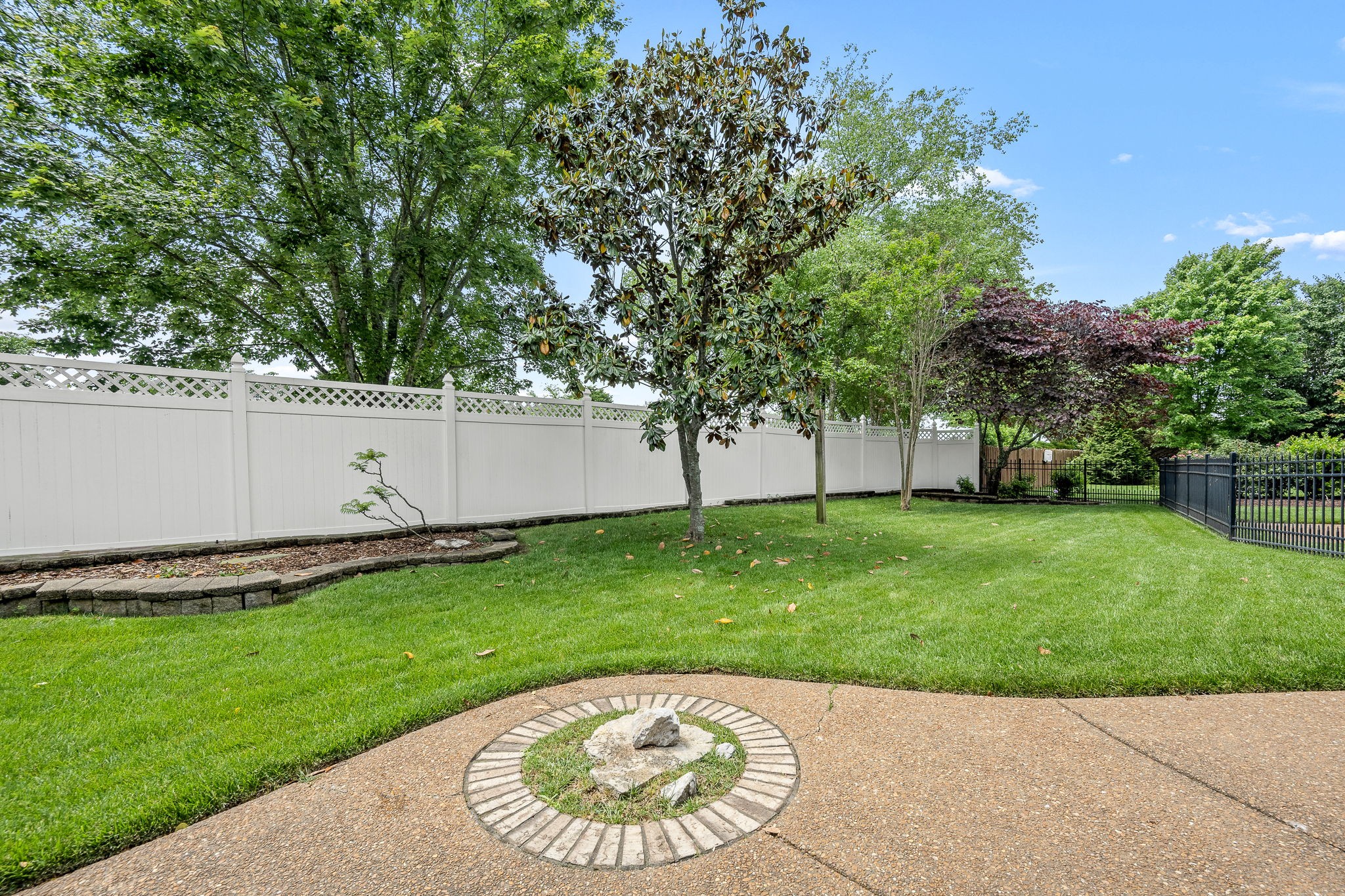3040 Havasu Drive Spring Hill, TN 37174 - Photo 54 of 55 a view of a backyard with a garden and trees