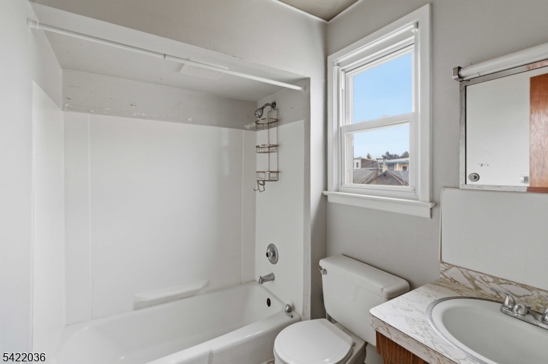 36 Edison Street Bloomfield, NJ 07003 - Photo 14 of 28 a bathroom with a sink toilet and shower