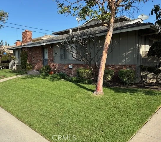 a view of a wooden house with a yard