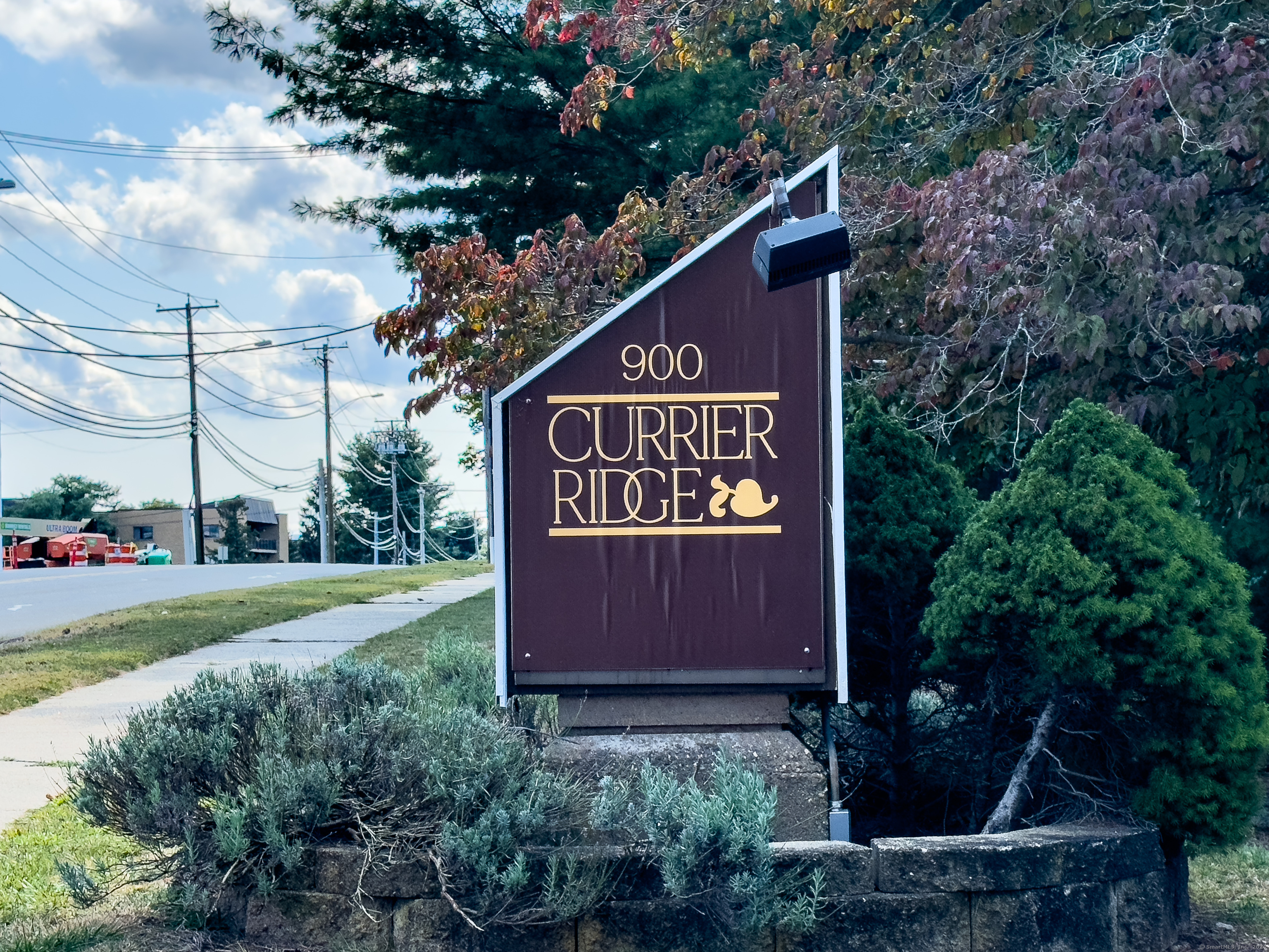 900 Mix Avenue, Unit 3 Hamden, CT 06514 - Photo 1 of 1 a sign on the side of the road
