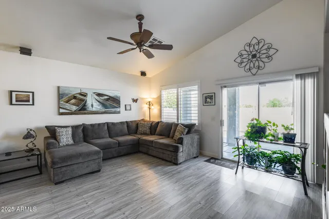 a living room with furniture and a large window