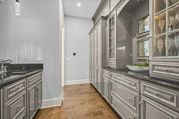 a spacious bathroom with a double vanity sink a mirror and a bathtub