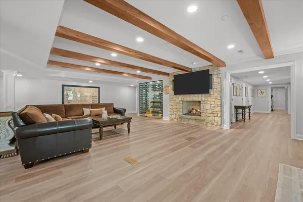 a view of a kitchen with fridge and wooden floor
