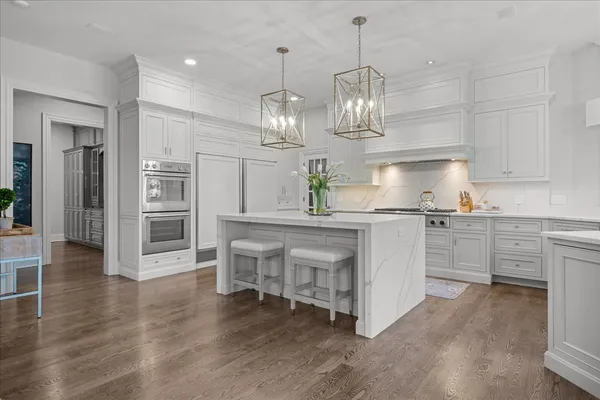 a dining room with furniture and wooden floor