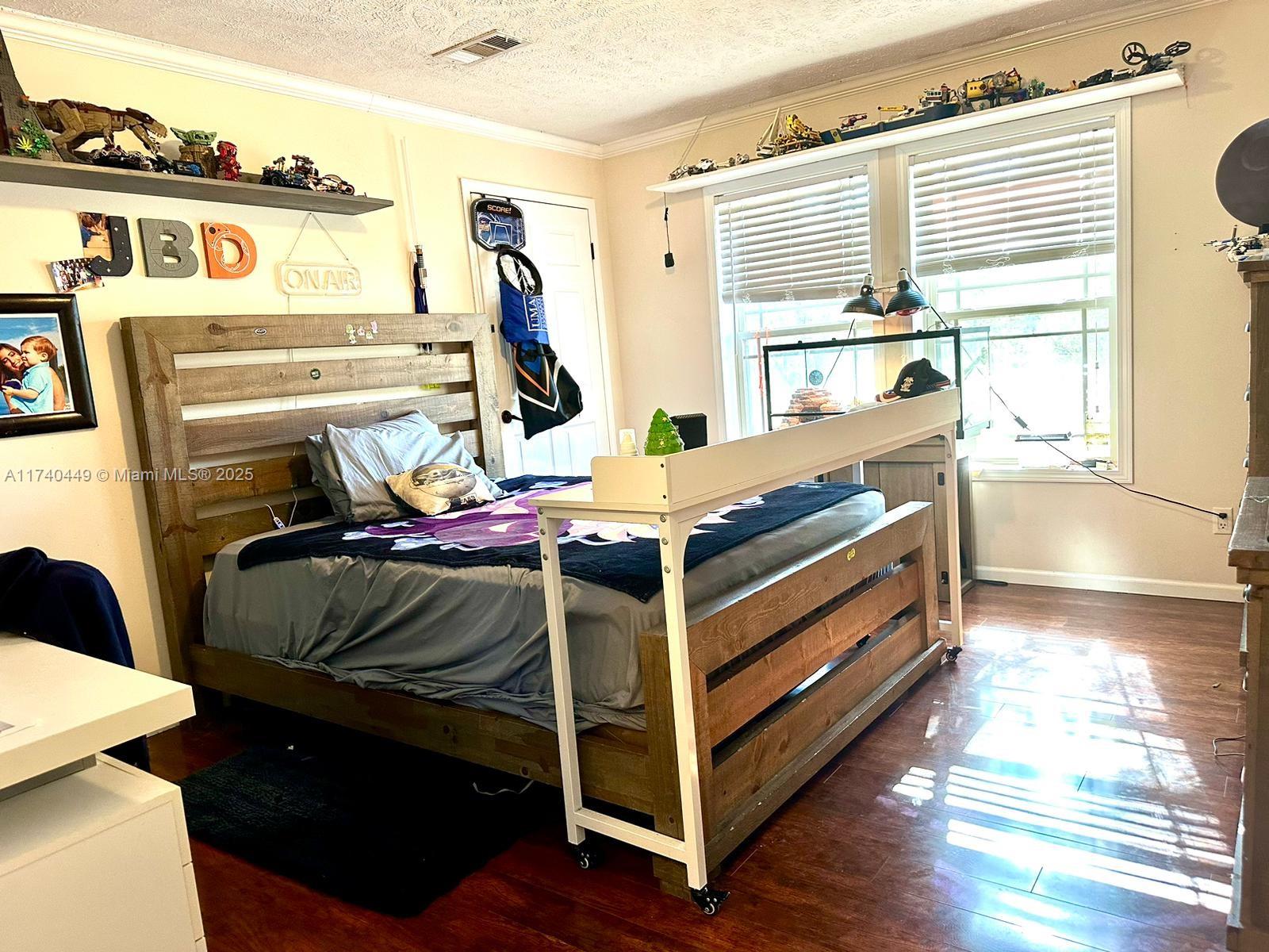 195 Southwest Turkey Glen Fort White, FL 32038 - Photo 11 of 25 a bedroom with a bed and a window