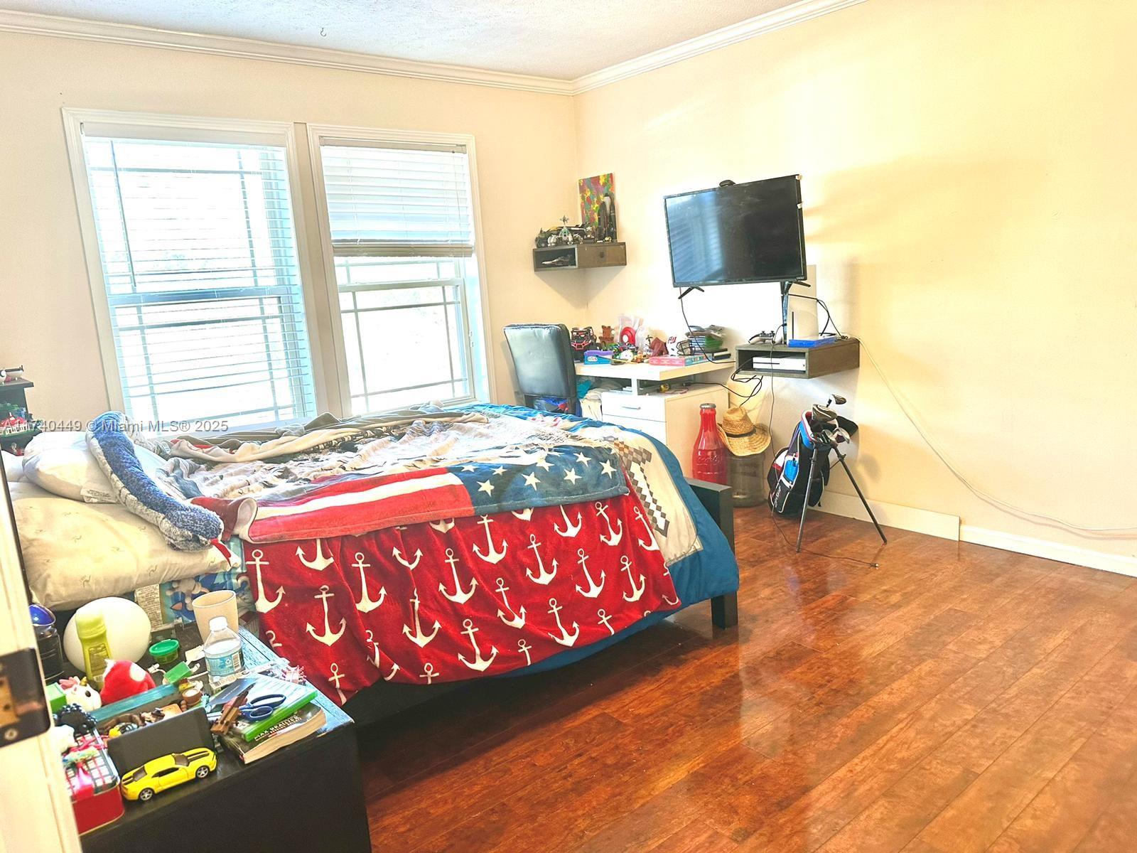 195 Southwest Turkey Glen Fort White, FL 32038 - Photo 14 of 25 a bedroom with a bed dresser and a window