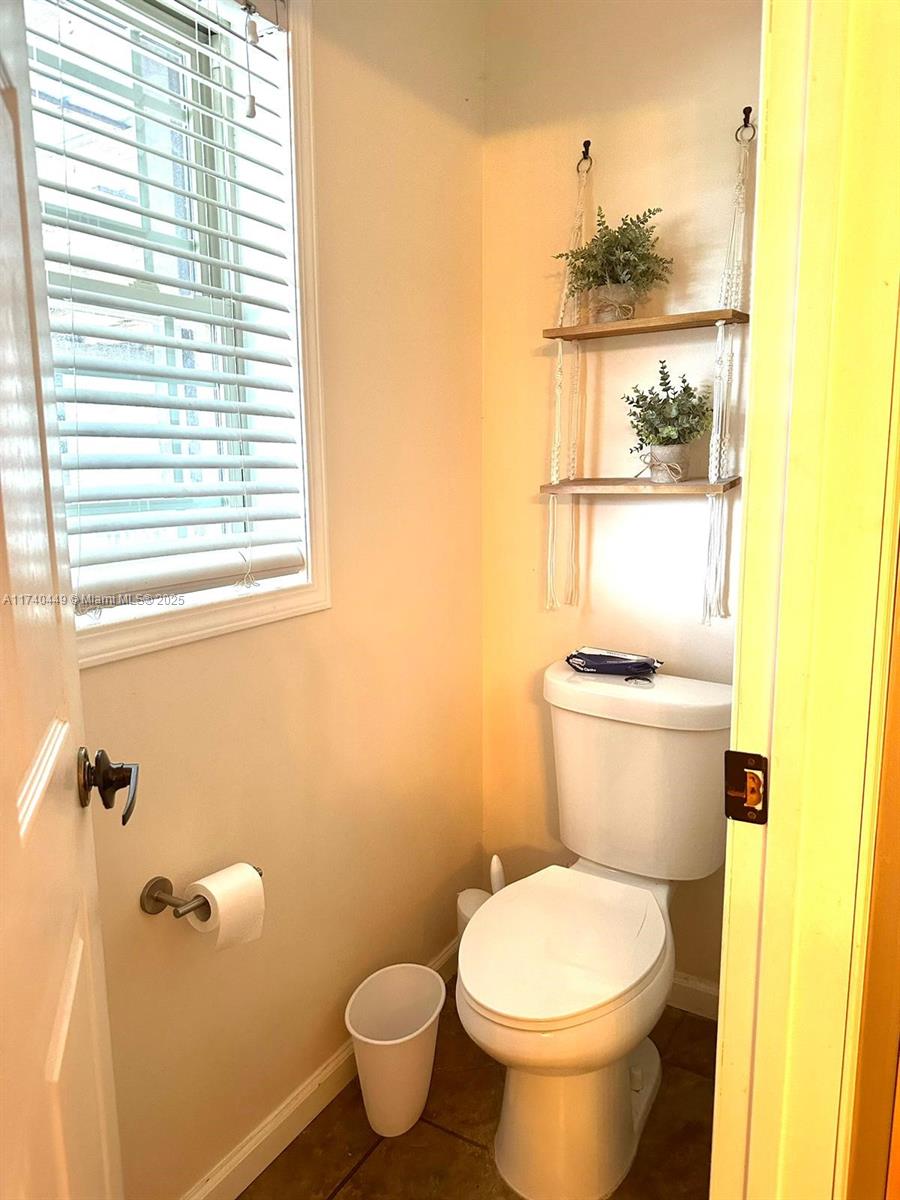 195 Southwest Turkey Glen Fort White, FL 32038 - Photo 23 of 25 a white toilet sitting next to a bathroom sink