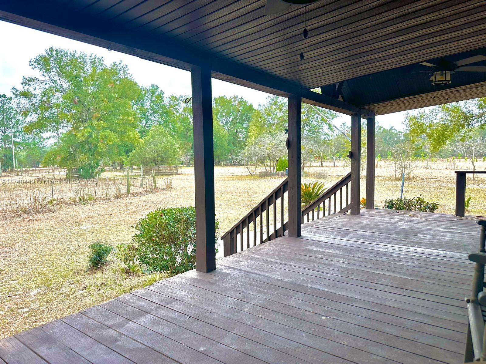 195 Southwest Turkey Glen Fort White, FL 32038 - Photo 5 of 25 a view of a balcony with wooden floor