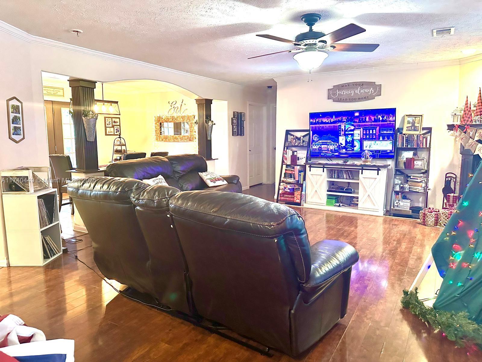 195 Southwest Turkey Glen Fort White, FL 32038 - Photo 9 of 25 a living room with furniture and a fireplace