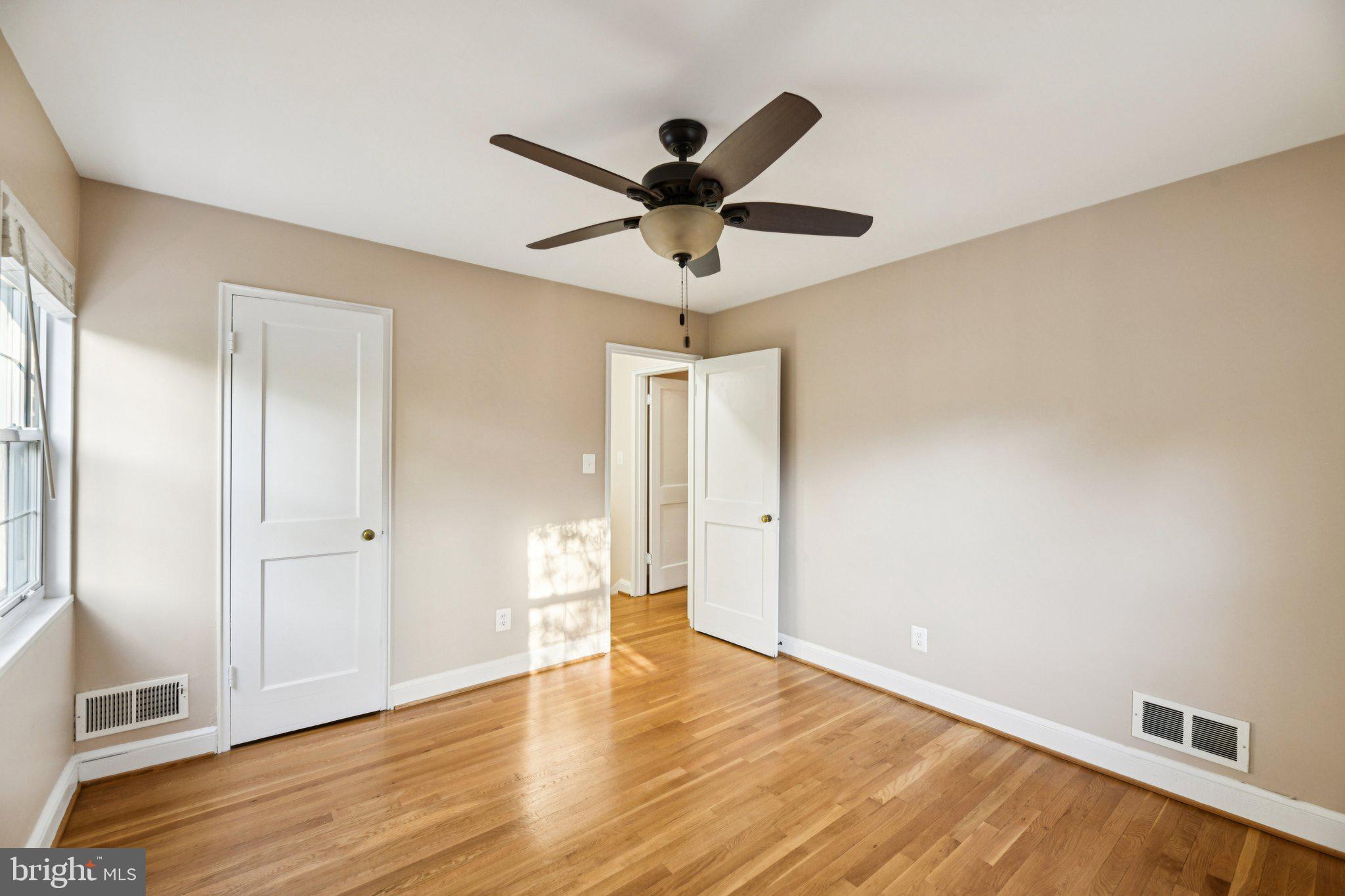 4012 Beechwood Road University Park, MD 20782 - Photo 26 of 56 a view of empty room with wooden floor